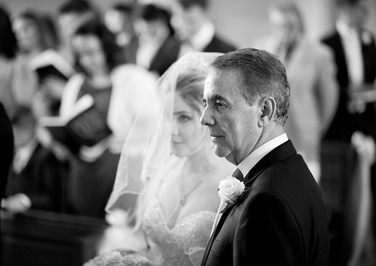 bride and her father during wedding service
