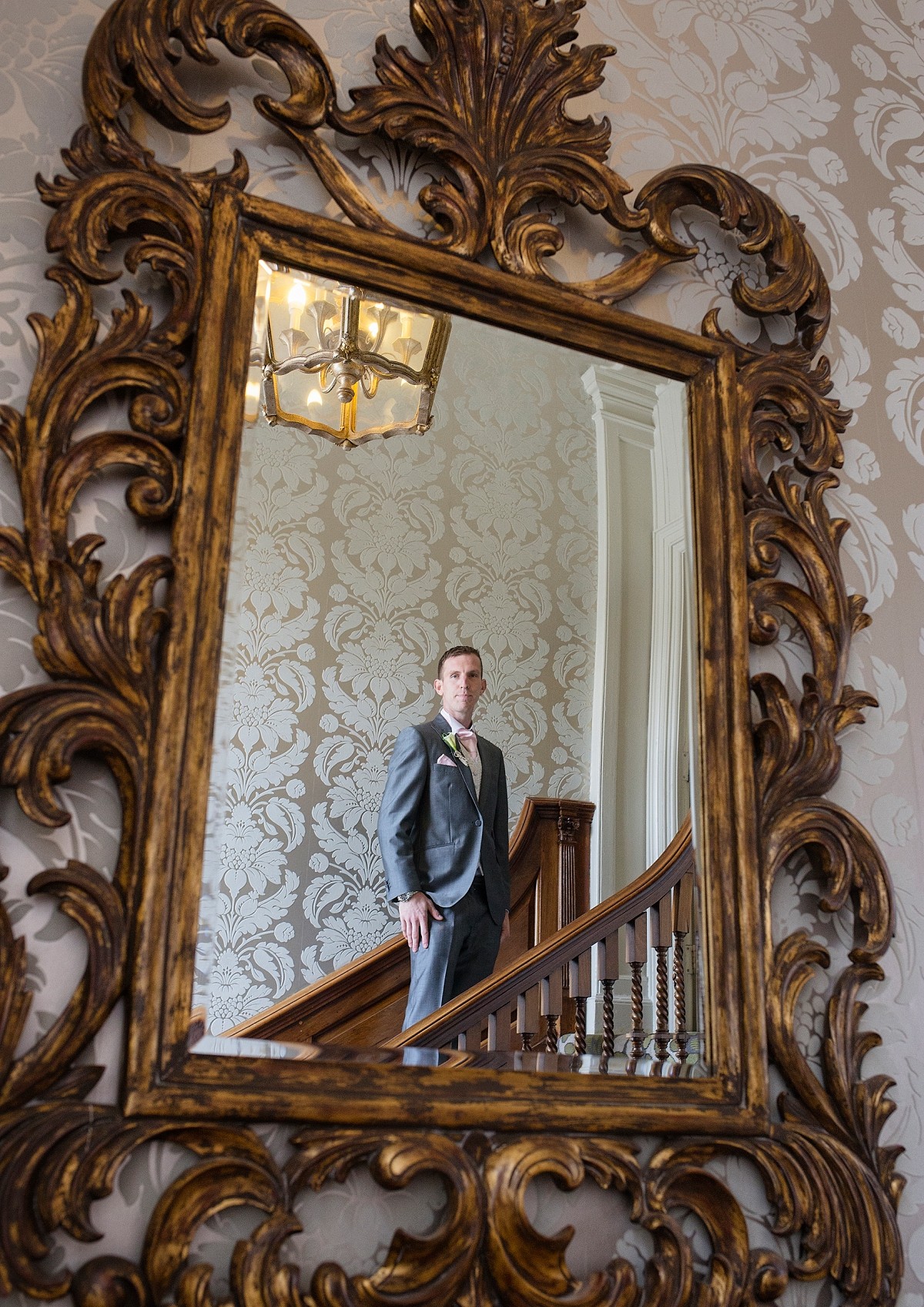 portrait of groom in mirror