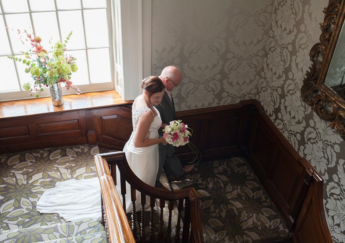 on stairs on the way to ceremony room