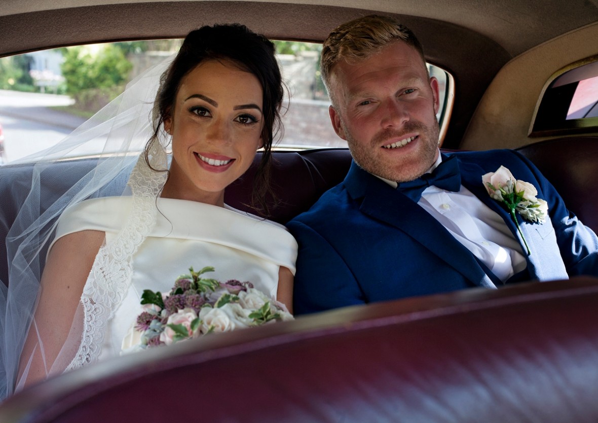 Bride and Groom inside the limo