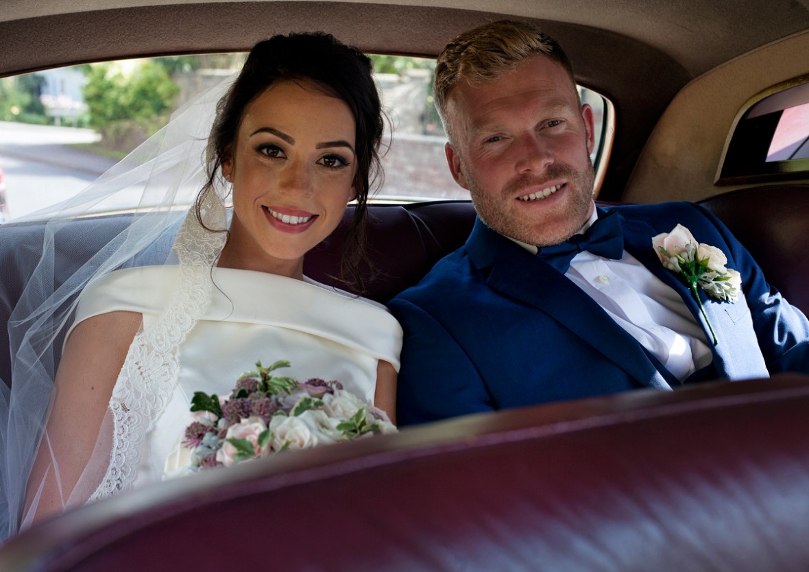 Bride and Groom inside the limo